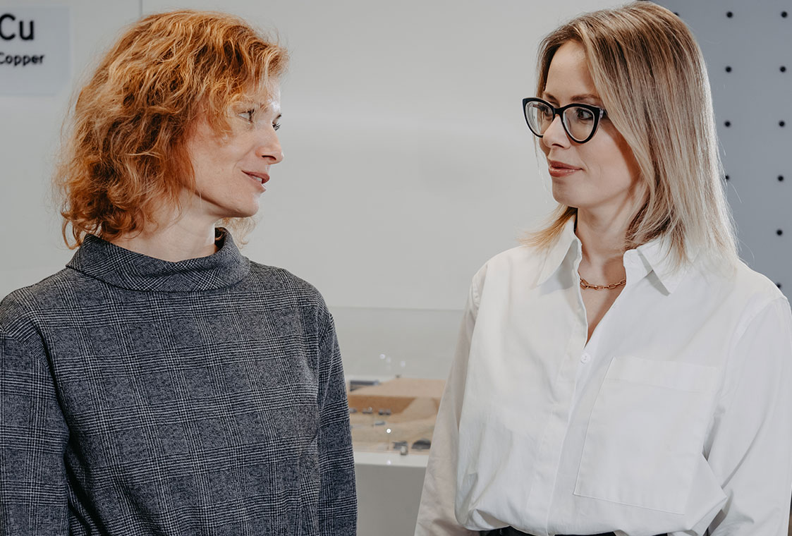 Two Metso employees discussing at an open office space.