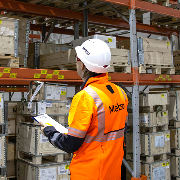 Warehouse manager inspects products